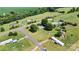Aerial view of a property in a rural landscape with green fields and trees at 338 Hickory Grove Rd, Harmony, NC 28634