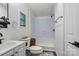 Bright bathroom featuring a vanity, toilet and shower/tub combination with tile surround at 338 Hickory Grove Rd, Harmony, NC 28634