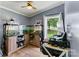 Inviting bedroom featuring a modern desk, an aquarium and a window with backyard view at 338 Hickory Grove Rd, Harmony, NC 28634
