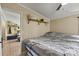 Cozy bedroom showcasing neutral walls, crown molding, and shelving for decor at 338 Hickory Grove Rd, Harmony, NC 28634