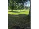Front yard with mature trees and a well-maintained lawn at 338 Hickory Grove Rd, Harmony, NC 28634