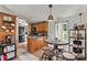 Eat-in kitchen featuring hardwood floors, oak cabinetry, and space for dining at 338 Hickory Grove Rd, Harmony, NC 28634