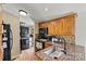 Charming kitchen featuring granite countertops, tile backsplash and stackable washer/dryer at 338 Hickory Grove Rd, Harmony, NC 28634