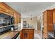 Lovely kitchen featuring wood cabinets, granite countertops and stainless steel sink at 338 Hickory Grove Rd, Harmony, NC 28634