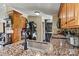 A kitchen features granite countertops, stainless steel appliances, and a laundry area at 338 Hickory Grove Rd, Harmony, NC 28634