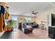 Cozy living room featuring a comfortable couch, ceiling fan, views of the landscape, and ample natural light at 338 Hickory Grove Rd, Harmony, NC 28634