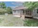Backyard featuring a small wooden deck, patio, and lawn at 3709 Creek Ridge Dr, Denver, NC 28037