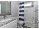Bathroom with gray walls, granite countertop, and striped shower curtain at 3709 Creek Ridge Dr, Denver, NC 28037