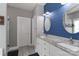 Stylish bathroom features dual sinks, granite counters, framed mirrors, and shiplap accent wall at 3709 Creek Ridge Dr, Denver, NC 28037