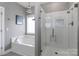 Bathroom features a separate tub and shower with white subway tile surround, great natural light at 3709 Creek Ridge Dr, Denver, NC 28037