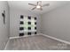 Cozy bedroom with neutral paint, a ceiling fan, and a window adorned with stylish curtains at 3709 Creek Ridge Dr, Denver, NC 28037