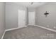 Comfortable bedroom with soft carpeting and easy access to en-suite bathroom at 3709 Creek Ridge Dr, Denver, NC 28037