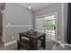 Dining area with a rustic wood table set near sliding glass doors at 3709 Creek Ridge Dr, Denver, NC 28037