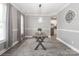 Stylish dining area featuring neutral tones, modern lighting, and a clear view into the adjacent kitchen at 3709 Creek Ridge Dr, Denver, NC 28037