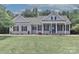 Charming home with gray siding, black shutters, well-manicured lawn, and a welcoming blue front door at 3709 Creek Ridge Dr, Denver, NC 28037