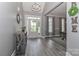 Welcoming foyer with gray walls, wood-look flooring, and views into the living and dining spaces at 3709 Creek Ridge Dr, Denver, NC 28037