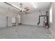 Spacious garage with epoxy flooring, tool storage, and ample lighting at 3709 Creek Ridge Dr, Denver, NC 28037