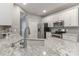 Modern kitchen features granite counters, stainless appliances, subway tile backsplash and white cabinetry at 3709 Creek Ridge Dr, Denver, NC 28037