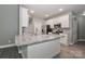 Modern kitchen with gray cabinets, granite counters, and stainless steel appliances at 3709 Creek Ridge Dr, Denver, NC 28037