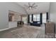 Open-concept living room with a vaulted ceiling, ceiling fan, and natural light at 3709 Creek Ridge Dr, Denver, NC 28037