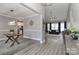 Open-concept interior showcasing modern flooring, neutral walls, and a seamless transition to the dining area at 3709 Creek Ridge Dr, Denver, NC 28037