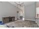 Spacious living room with a vaulted ceiling, modern fan, and gray walls at 3709 Creek Ridge Dr, Denver, NC 28037
