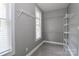 Spacious walk-in closet with a window for natural light and shelving to organize belongings at 3709 Creek Ridge Dr, Denver, NC 28037