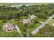 Aerial view of a home with a pool, gazebo, and beautifully landscaped yard, showcasing the property's setting at 389 Ponderosa Cir, Mooresville, NC 28117