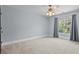 Bedroom with a ceiling fan, carpet, and window with curtains at 389 Ponderosa Cir, Mooresville, NC 28117