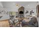 Bright living room with hardwood floors, stone fireplace, access to back porch via sliding glass doors at 389 Ponderosa Cir, Mooresville, NC 28117