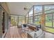 Spacious sunroom featuring comfortable seating and panoramic views of the outdoors at 389 Ponderosa Cir, Mooresville, NC 28117