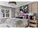 Serene bedroom with large window, contemporary lighting, and neutral color palette at 4110 Lattistep Ln, Charlotte, NC 28269