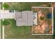Aerial view of the home showing a spacious backyard with a patio and trampoline at 413 Wheat Field Dr, Mount Holly, NC 28120