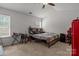 Neutral bedroom with a ceiling fan, a window, and carpet flooring at 413 Wheat Field Dr, Mount Holly, NC 28120
