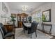 Formal dining area features sophisticated decor and a large window for natural light at 413 Wheat Field Dr, Mount Holly, NC 28120