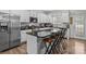 Kitchen with white cabinetry and stainless steel appliances, plus a center island at 413 Wheat Field Dr, Mount Holly, NC 28120