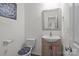 A half bathroom with elegant toilet seat has a mirror and a vanity with a faucet at 413 Wheat Field Dr, Mount Holly, NC 28120