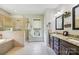 Bathroom with a glass shower, a tub, double sinks, and granite countertops at 4151 Green Park Ct, Harrisburg, NC 28075
