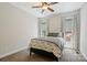 This bedroom has cozy carpet and two windows that give plenty of natural light at 4151 Green Park Ct, Harrisburg, NC 28075