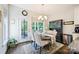 The dining area includes an oval table with seating for four, large windows, and a china cabinet at 4151 Green Park Ct, Harrisburg, NC 28075