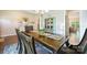 Dining room has a view to the kitchen, hardwood floors and lovely furnishings at 4151 Green Park Ct, Harrisburg, NC 28075