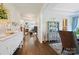 Entryway view showcases hardwood floors flowing into the living room with fireplace at 4151 Green Park Ct, Harrisburg, NC 28075