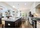 Open kitchen featuring a large island, stainless steel appliances, and hardwood floors at 4151 Green Park Ct, Harrisburg, NC 28075