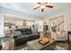 Comfortable living room with access to the dining area, kitchen and a staircase at 4151 Green Park Ct, Harrisburg, NC 28075