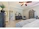 Comfortable main bedroom with a king bed, ceiling fan, and decorative furnishings at 4151 Green Park Ct, Harrisburg, NC 28075