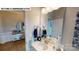 Well-lit bathroom featuring a vanity with sink, decorative mirror, and stylish accents at 505 York Rd, Troutman, NC 28166