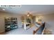 Bright loft space with desk, seating, and ceiling fan at 505 York Rd, Troutman, NC 28166