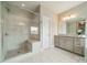 Bathroom featuring marble tile shower, and grey cabinets at 515 Lizzie Ln, Fort Mill, SC 29708