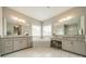 Bathroom with a soaking tub, vanity area and double sinks at 515 Lizzie Ln, Fort Mill, SC 29708