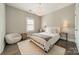 Bedroom featuring stylish lighting, large window and rug at 515 Lizzie Ln, Fort Mill, SC 29708